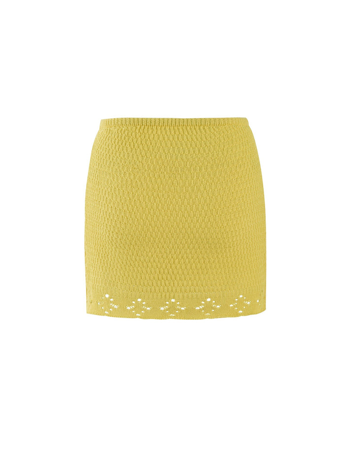 The JANAI SKIRT - YELLOW : LEMON from TIGERMIST is a yellow, crochet-style mini skirt featuring a subtle diamond pattern throughout and a decorative lace trim at the hem. The form-fitting skirt appears to be made from light, breathable fabric and is displayed on a plain white background.