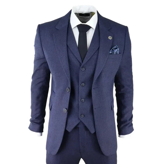 Men's navy blue herringbone tweed 3-piece suit with blazer, waistcoat, and trousers, featuring a turn-down collar, pocket square, and tailored fit.