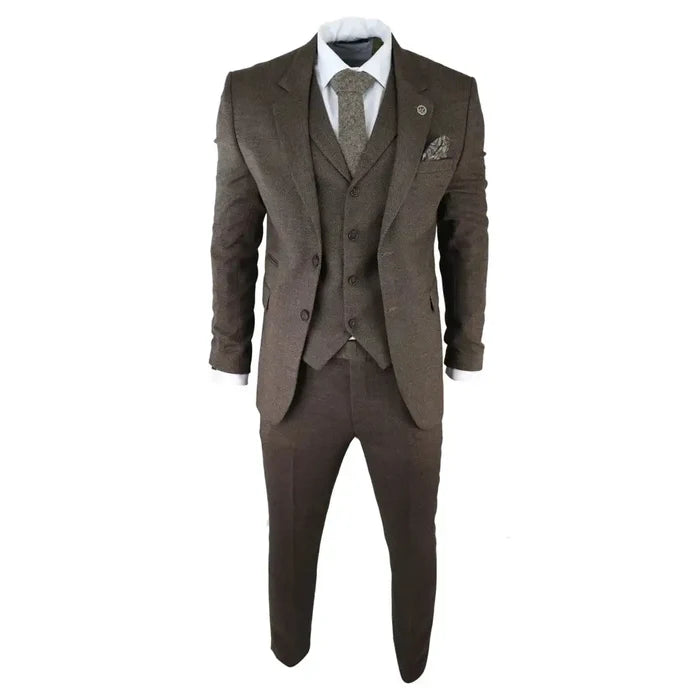 Close-up of men's brown herringbone tweed 3-piece suit with blazer, waistcoat, white shirt, and matching tie, detailed fabric texture
