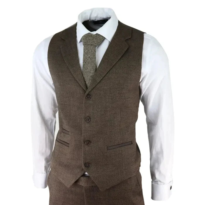 Men's brown herringbone tweed 3 piece suit with blazer, waistcoat, and trousers, paired with a white shirt and matching herringbone tie, tailored fit