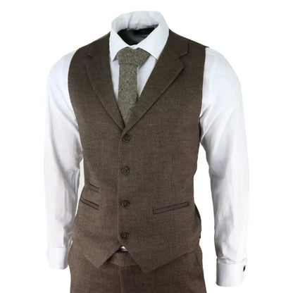 Men's brown herringbone tweed 3 piece suit with blazer, waistcoat, and trousers, paired with a white shirt and matching herringbone tie, tailored fit