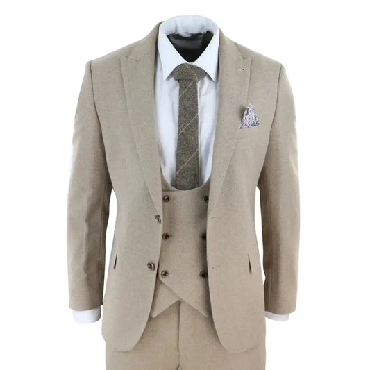 Men's beige tweed 3-piece suit with tailored fit, double-breasted waistcoat, white shirt, patterned tie, and pocket square for formal occasions.