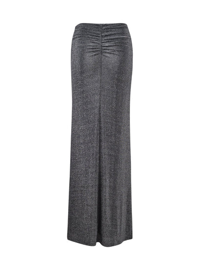 An ankle-length, black shimmer skirt from TIGERMIST, named the DAISIE SKIRT, featuring a high waist and ruching detail at the back. The fabric has a subtle shimmer, creating a sleek and elegant appearance.
