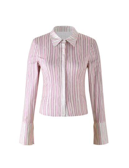 This long-sleeved, fitted blouse from TIGERMIST, known as the DARCEE SHIRT - PINK: PINK PINSTRIPE, features a classic collar and vertical stripes in various shades of pink and white. It has a button-down front, and the fabric appears lightweight and slightly sheer.