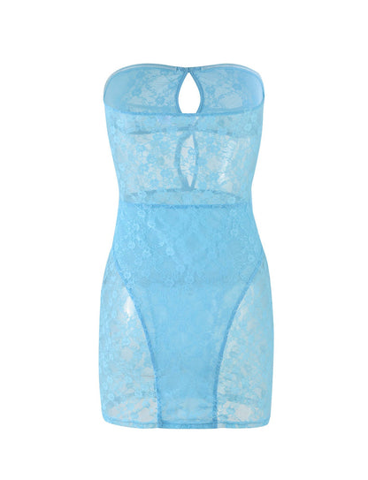 The DIDA DRESS in baby blue from TIGERMIST is a form-fitting, strapless dress that features a keyhole cutout at the front of the neckline and a sheer floral lace pattern throughout, creating a delicate and elegant appearance.