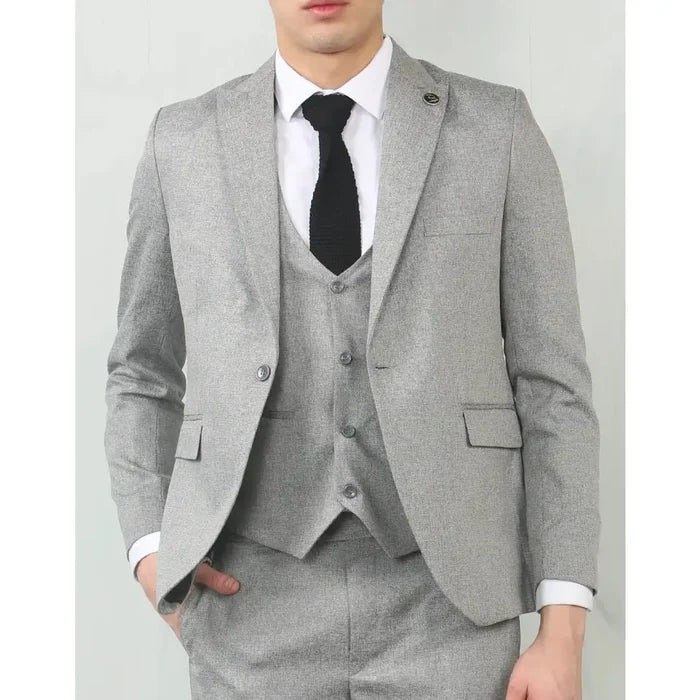 Men's grey tailored fit wedding 3-piece suit with a modern slim cut, featuring a matching jacket, vest, and trousers, worn with a white shirt and black tie.