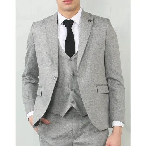Men's grey tailored fit wedding 3-piece suit with a modern slim cut, featuring a matching jacket, vest, and trousers, worn with a white shirt and black tie.