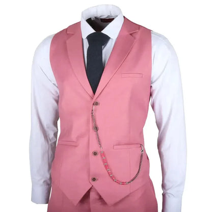 Men's pink tailored fit 3-piece suit with a white dress shirt, black tie, and chain accessory, showcasing a stylish formal look