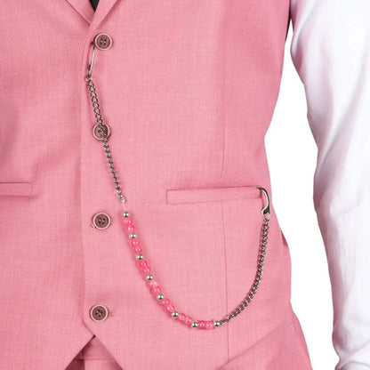 Close-up of pink suit vest with chain accessory, showing fabric details and button design for men's fashion