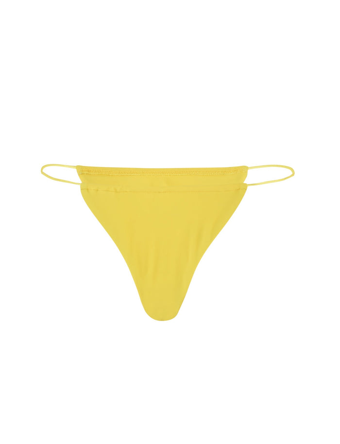 The KRYZE BIKINI BOTTOM - YELLOW : NEON YELLOW from TIGERMIST is depicted. This bright yellow thong features thin side straps. The fabric appears smooth and form-fitting, designed for minimal coverage. The front has a simple triangular shape, with equally thin side straps for a streamlined look.