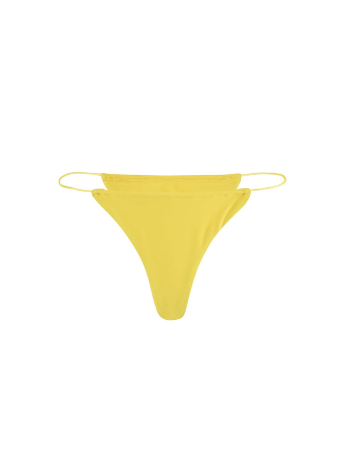 A vibrant neon yellow Kryze bikini bottom with thin side straps and a minimalist design from TIGERMIST, photographed against a plain white background.