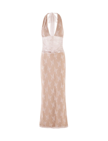 The LENORA LACE DRESS by TIGERMIST is a sleeveless, form-fitting white dress featuring a halter neckline and a semi-sheer bodice with a floral lace overlay. The lower portion of this stunning creation is adorned with an intricate, embroidered floral pattern.