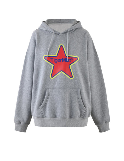 The LUMEN HOODIE - GREY by TIGERMIST features a large red star graphic with a yellow outline and the text "Tiger Mist" in blue across the star. This stylish gray hoodie includes a front pocket and an adjustable drawstring at the neck.
