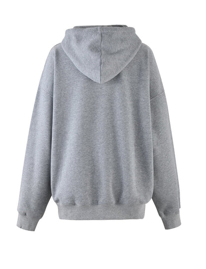 A back view of the LUMEN HOODIE - GREY by TIGERMIST. This hoodie features a relaxed fit with long sleeves, ribbed cuffs, and a ribbed hem. The fabric appears to be soft and comfortable, maintaining the brand's signature quality. There are no visible logos or designs on the hoodie.