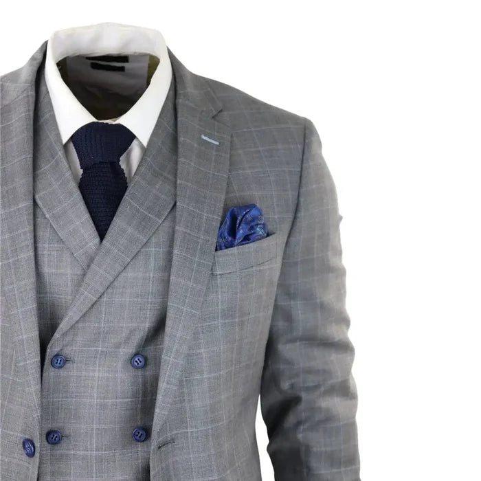 Men's light grey check suit with a tailored fit, featuring a double-breasted waistcoat, white shirt, navy knit tie, and blue pocket square for formal occasions.