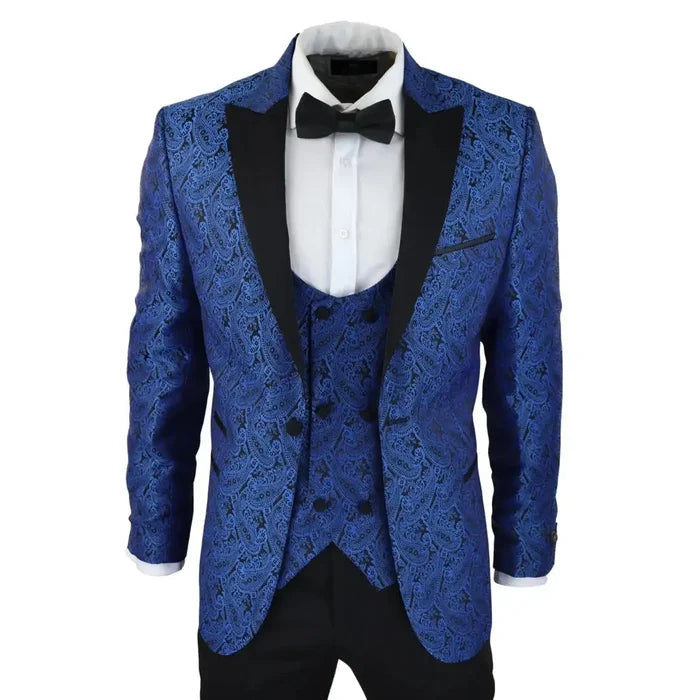 Men's blue paisley tuxedo blazer with black satin peak lapels, matching waistcoat, and white dress shirt with black bow tie, formal evening wear