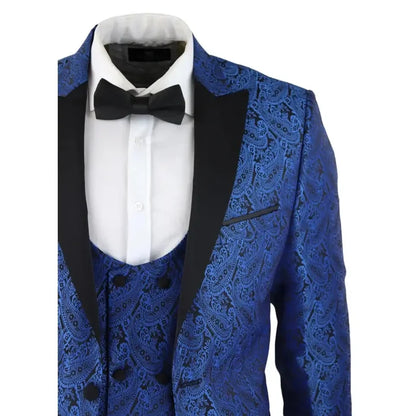 Close-up of men's blue paisley tuxedo jacket with black satin lapel, detailed pattern, and white dress shirt with bow tie, front view