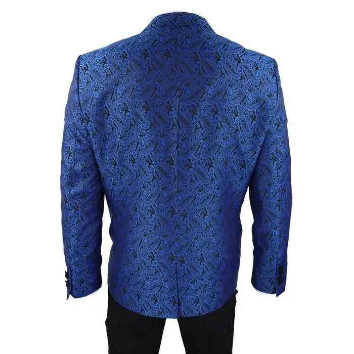 Back view of men's blue paisley tuxedo jacket with structured shoulders and detailed pattern, paired with black trousers