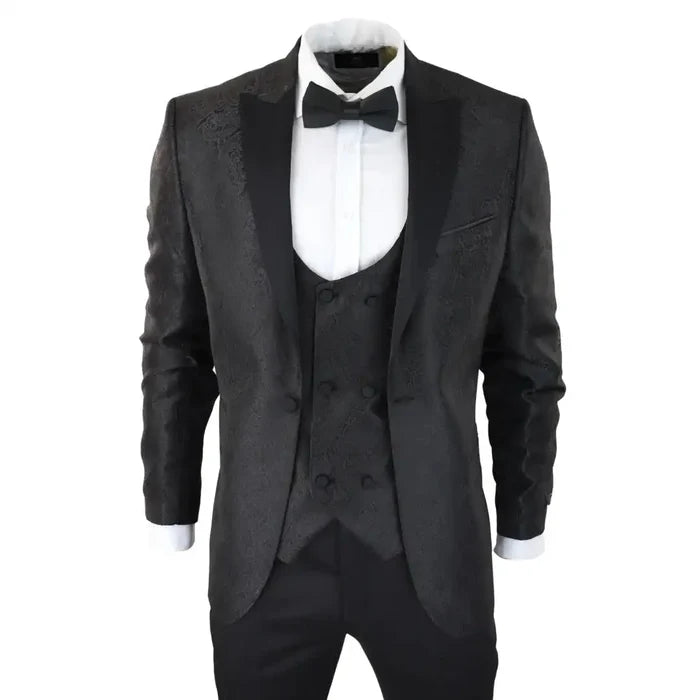 Men's black paisley tuxedo blazer with satin peak lapels, matching waistcoat, white dress shirt, and black bow tie, formal evening wear