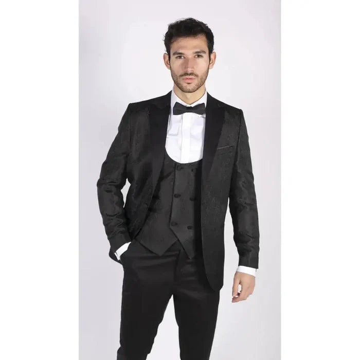 Front view of a man in black tuxedo with paisley pattern, white shirt, and black bow tie, stylish formal suit for events