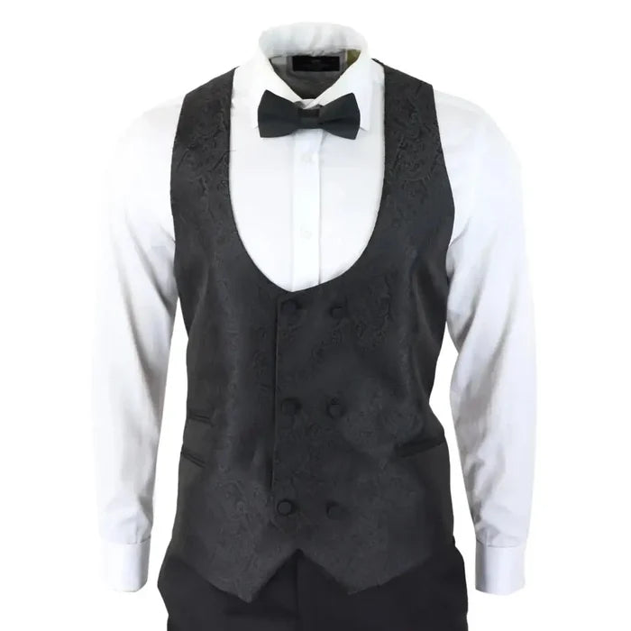 Men's black paisley tuxedo vest with matching buttons, worn over a white dress shirt with a black bow tie, suitable for formal events
