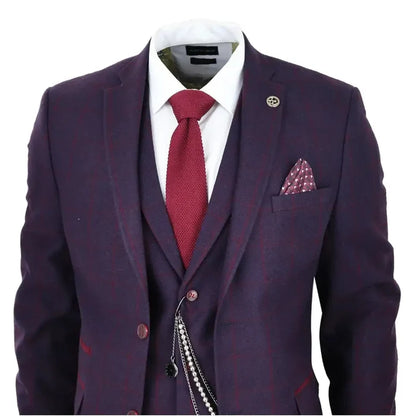 Men's 3 piece suit in plum wine check wool tweed with notch lapel, white dress shirt, red tie, pocket square, and lapel pin, tailored for formal occasions