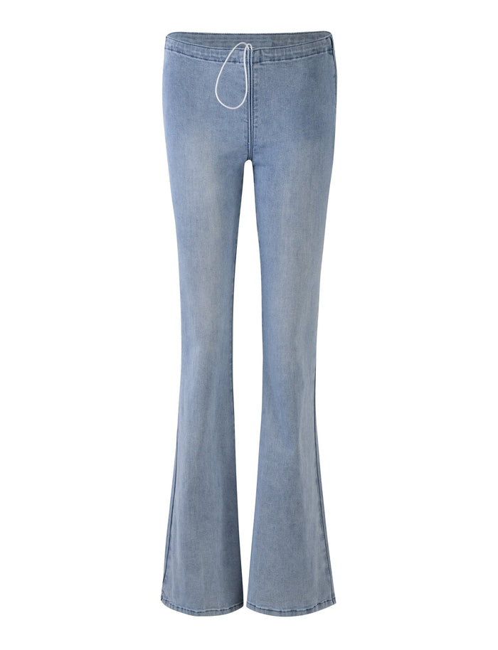 Introducing the TIJANA JEAN - BLUE by TIGERMIST, a pair of denim blue jeans with a slight flare at the bottom. These stylish jeans feature a drawstring waistband, a seamless front, and are crafted from stretchy, comfortable material. The denim boasts a soft, faded appearance for that perfect worn-in look.
