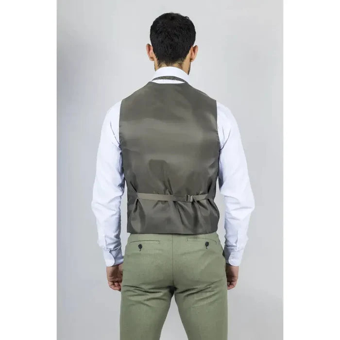 Back view of a man wearing a men's sage green 3-piece linen summer wedding suit with a vest, white shirt, and khaki pants, standing against a plain background.
