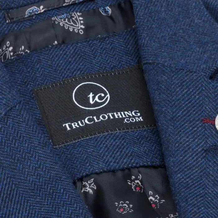 Side view of women's navy blue tweed blazer highlighting tailored silhouette, notch lapel, and textured fabric.